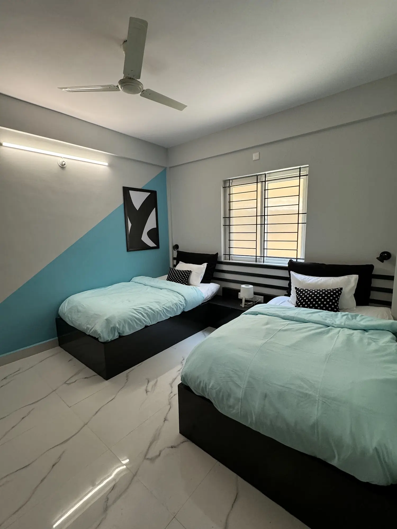 Twin room with two beds by the window
