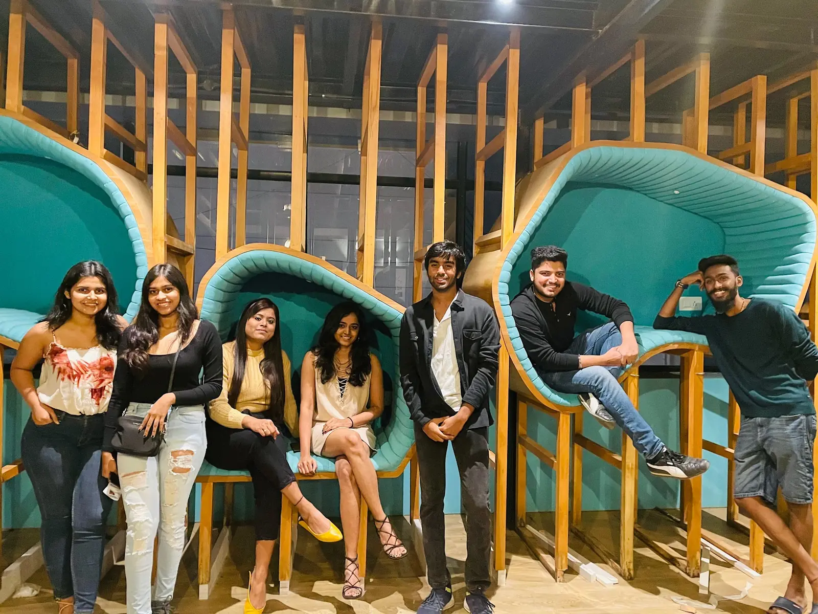 Residents together in teal pod chairs