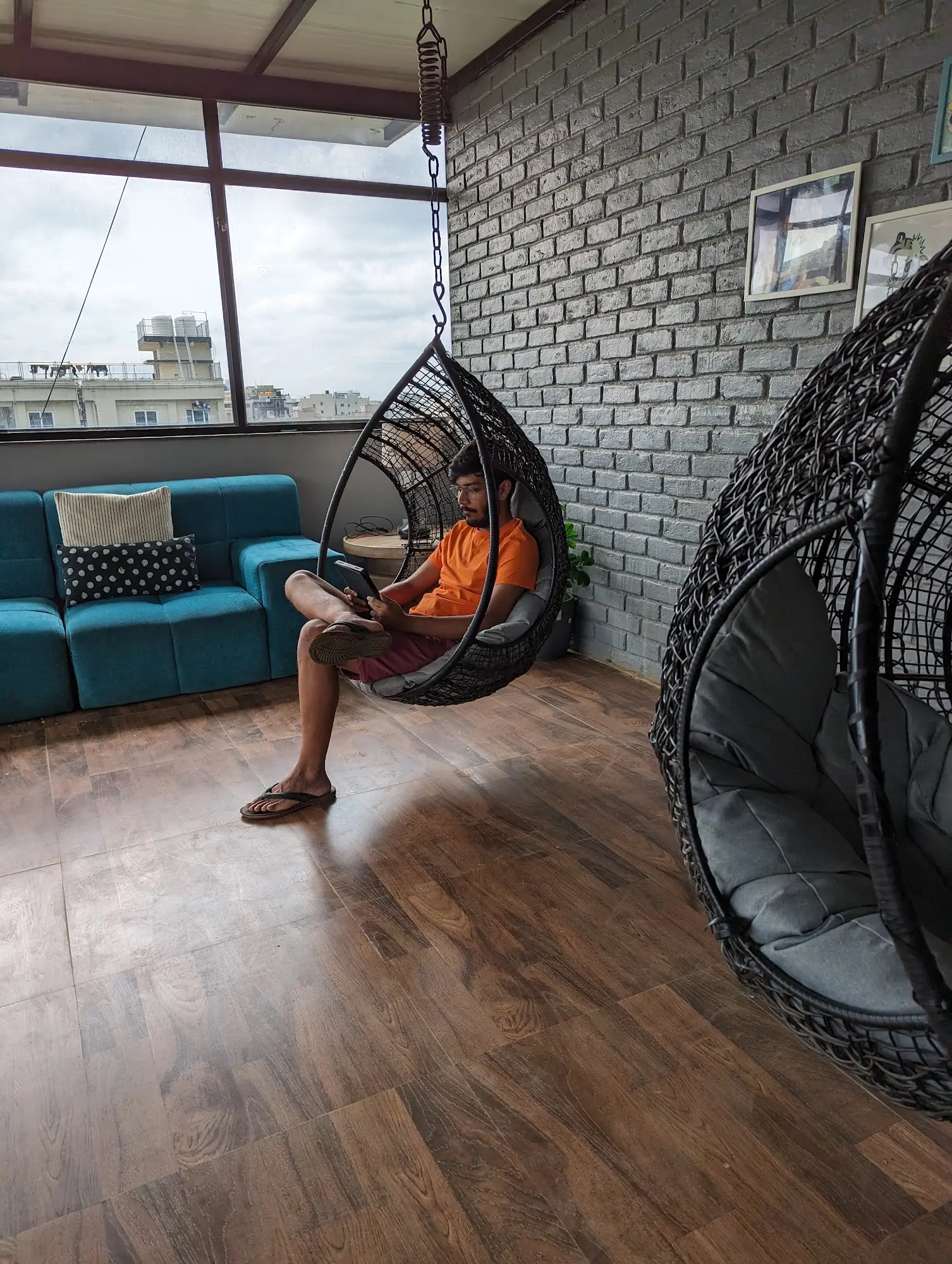 Resident relaxing in a hanging swing chair