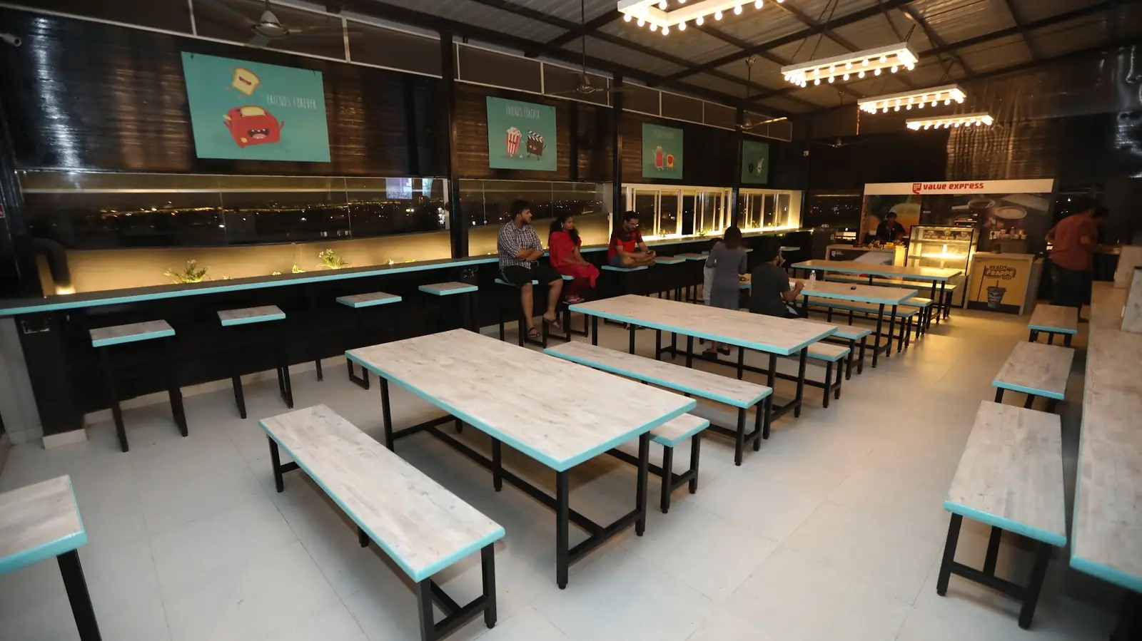 Dining hall with long tables and benches