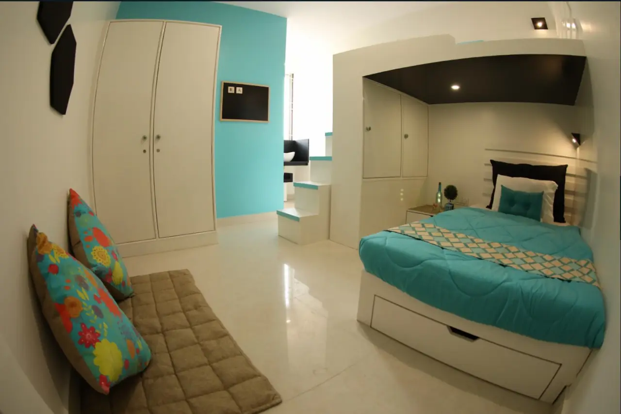 Room with teal linen and floor cushions