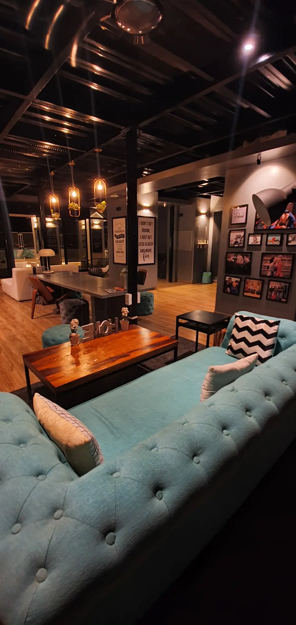 Dining and lounge area with a long wooden table