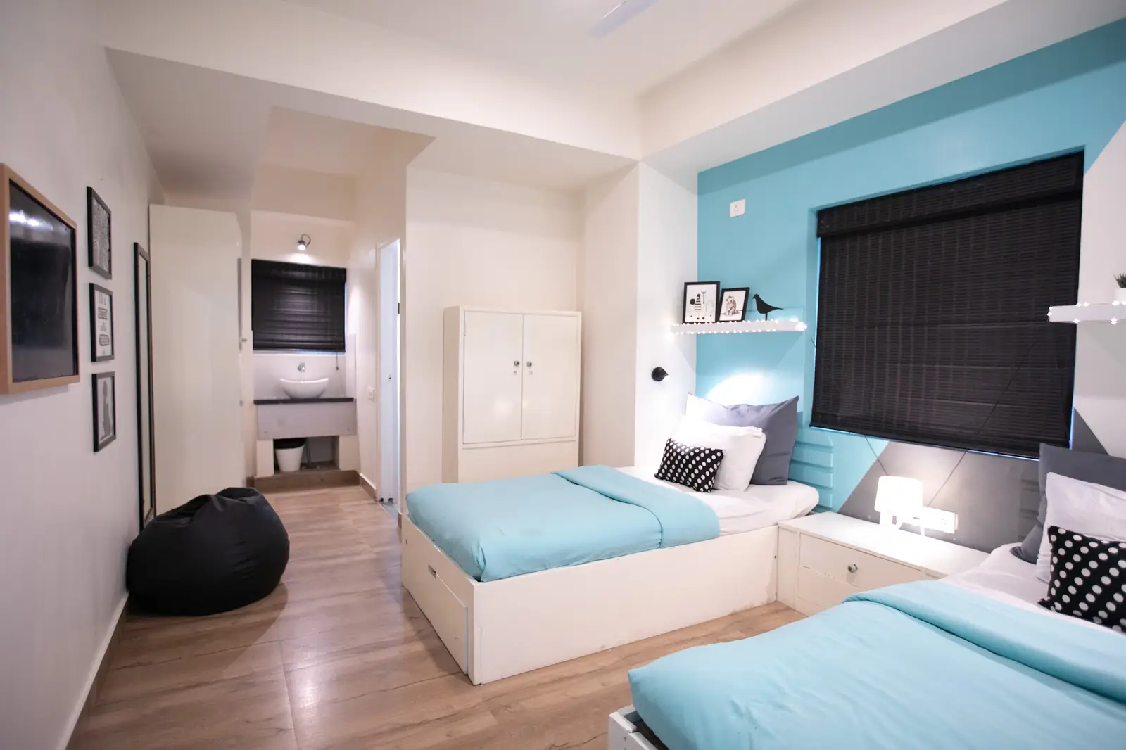 Twin room with two beds and teal linen