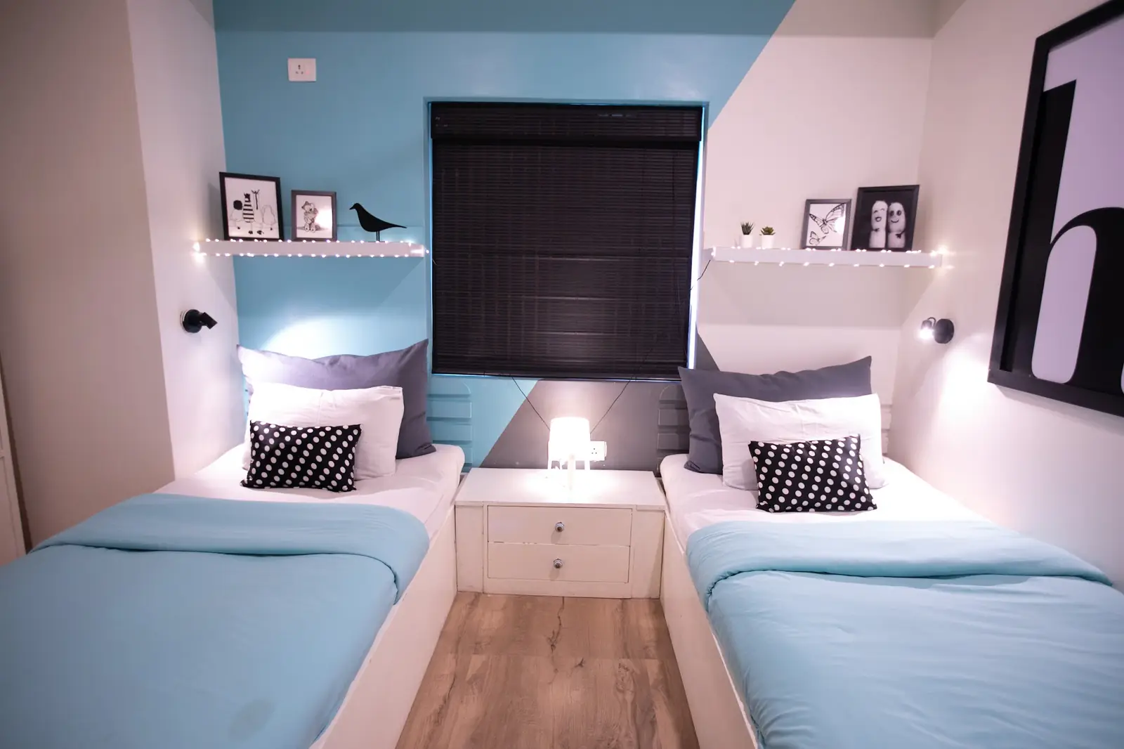 Twin room with two beds under a window