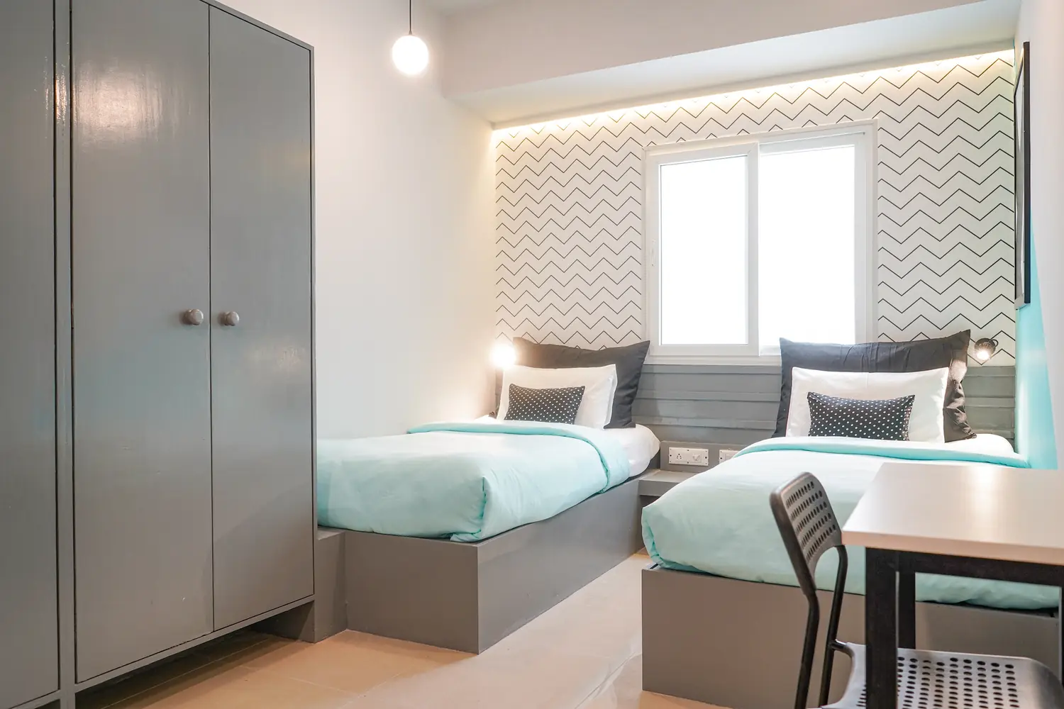 Studio with twin beds and a wardrobe