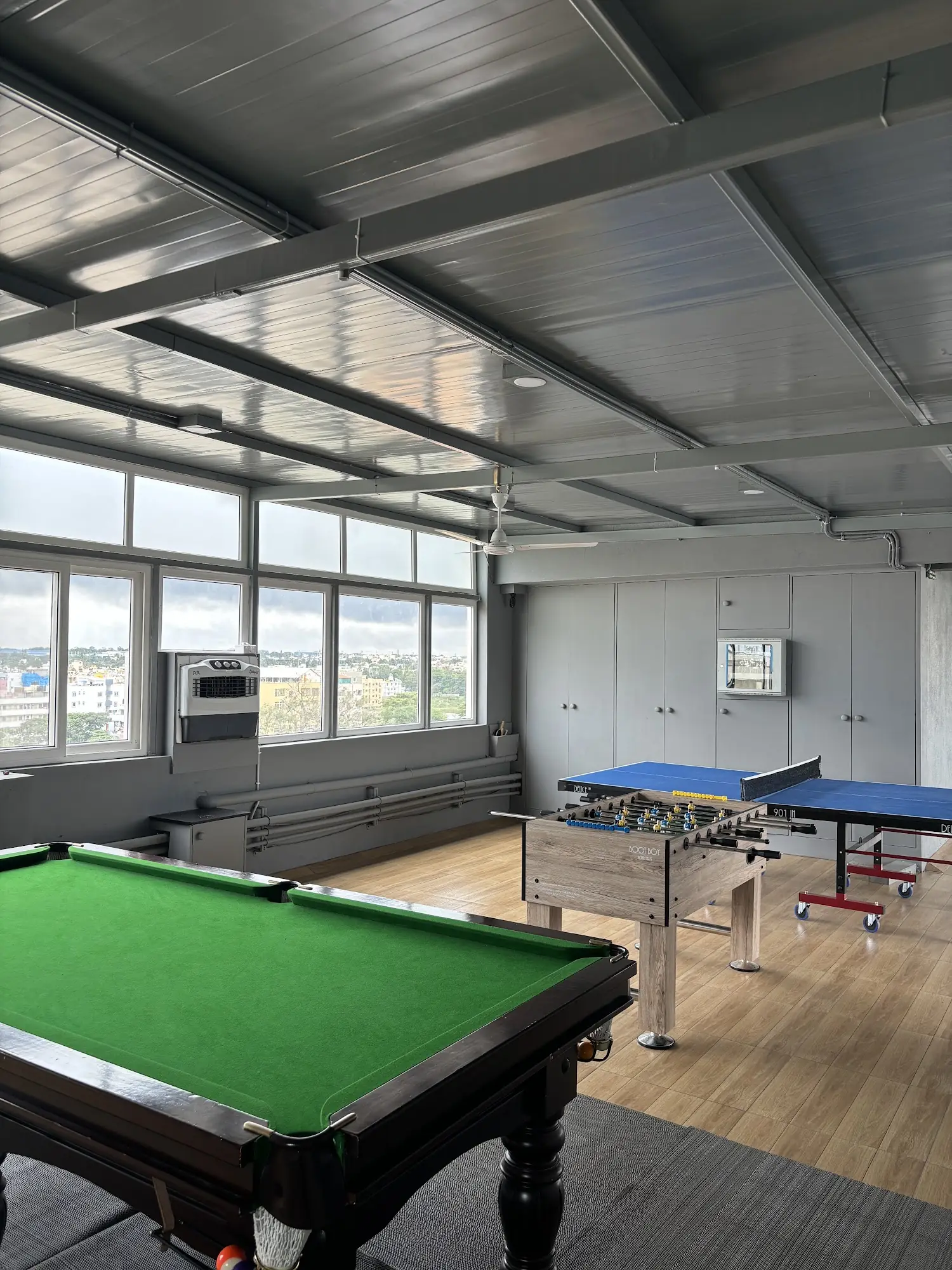 Game room with pool, foosball and table tennis